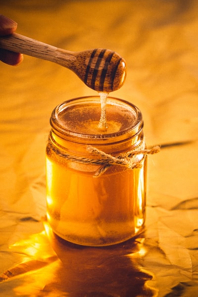 Transparent glass jar with a brown liquid
